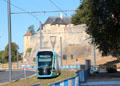 Trolley passes Caen Castle. Caen, France.