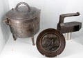 Iron cooking pot , souvenir plate & iron at Museum of Normandy. Caen, France.