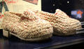 WWII shoes with wooden soles & woven palm leaf uppers at Caen Memorial. Caen, France.