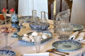 Rouen-made earthenware & glass serving platter, cruet set, caster & pitcher at Rouen Ceramic Museum. Rouen, France.