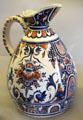 Rouen-made earthenware pitcher painted blue & red at Rouen Ceramic Museum. Rouen, France.