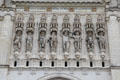 Niches above entrance to St. Maurice of Angers Cathedral containing figures in military dress representing St. Maurice & his companions. Angers, France.