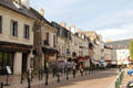 Cafés & shops along pedestrian street in front of Royal Chateau of Amboise. Amboise, France.