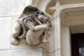 Monkey playing bagpipe corbel on window surround of Louis XII Gothic wing at Blois Chateau. Blois, France.