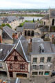 Half-timbered building & Saint-Nicolas church seen from Blois Chateau with Loire river beyond. Blois, France.