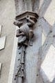 Carving detail of man in Medieval dress holding up structure on Acrobats house. Blois, France.