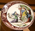 Joan of Arc in bois Chesnu porcelain plate By Sarreguemines Factory in Royal Lodgings museum at Château de Chinon. Chinon, France.