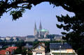 Chartres Cathedral rises over town & countryside. Chartres, France.