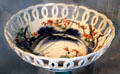 Lacework porcelain bowl with oriental style blue & red painting of plant at Chateau D'Ussé. Ussé, France.