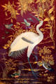 Inlaid oriental plaque of crane & small birds on red & gold background at Chateau D'Ussé. Ussé, France.