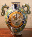 Antique jug with spout & dolphin handles painted with religious theme at Chateau D'Ussé. Ussé, France.