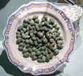 Trompe l'oeil faience plate with fake olives from France at Orleans Beaux Arts Museum. Orleans, France.