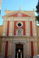 Facade of Church of the Immaculate Conception with statue of Virgin Mary. Antibes, France.