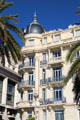 Building with dome & ornate iron balconies along Promenade des Anglais. Nice, France.
