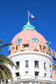 Dome flying French flag of Hotel Le Negresco on Promenade des Anglais. Nice, France.
