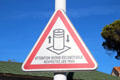 Warning sign about retractable parking bollard. Sainte-Maxime, France.
