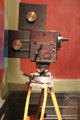 Gaumont camera with sprockets to advance film one frame at a time & exterior film magazine at Lumière Museum. Lyon, France.