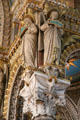 Carved columns topped with angels holding traits of Virgin Mary at Basilique Notre-Dame de Fourvière. Lyon, France.