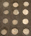 Papal coins with faces & symbols of Avignon popes at Papal Palace. Avignon, France.