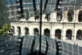 Arena of Nîmes seen through window of Musée de la Romanité. Nimes, France
