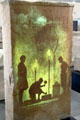 Museum film of Roman stone carver projected onto Roman funerary slab at Musée de la Romanité. Nimes, France.