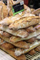 Bread stacks at Nimes market. Nimes, France.