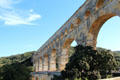 Downriver side with road at Pont du Gard. Nimes, France.