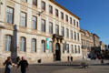 Archbishop's palace & entrance to cloister with post office beyond on Place de la République. Arles, France.
