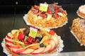 Cakes topped with fruit in Arles bakery. Arles, France.