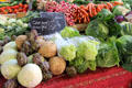 Artichokes & cabbages at vegetable market. Aix-en-Provence, France.