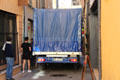 Truck navigates narrow streets of Aix. Aix-en-Provence, France.
