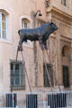 Sculpted bull on stilts behind Marseille city hall. Marseille, France.