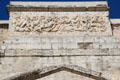 Relief of mounted Romans defeating enemies atop triumphal arch of Orange. Orange, France.