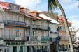 Row of shuttered buildings along rue Léonard. Pointe-à-Pitre, Guadeloupe.