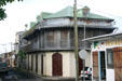 Creole-style building on city hall square in oldest town in Guadeloupe. Le Moule, Guadeloupe.