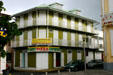 Building with rows of shutters and balconies. Le Moule, Guadeloupe.