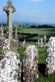 Graves at Rock of Cashel overlook green countryside. Ireland.