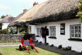 Thatched roof shops in village of Adare. Ireland.