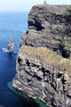 Rock tower remains in ocean of cliffs of Moher. Ireland.