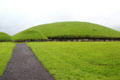 Main Neolithic passage grave & two of 17 smaller satellite tombs at Knowth. Ireland.