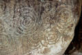 Neolithic carved stone with labyrinth-like design at Knowth. Ireland.