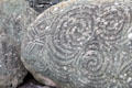 Detail of Megalithic carving on stone in front of entrance of passage tomb at Newgrange. Ireland.