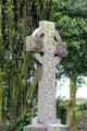 Modern Celtic cross with leaves at Monasterboice. Ireland.
