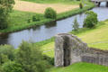 River Boyne with section of curtain wall of Trim Castle. Trim, Ireland