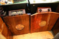 Floor radios with wood slab holing speaker & tuner on top at Hurdy Gurdy Museum of Vintage Radio. Howth, Ireland.