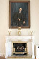 Fireplace with presidential portrait in state dining room at Aras an Uachtarain. Dublin, Ireland.