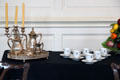 Coffee service & cups decorated with harps in dining room at Dublin Castle. Dublin, Ireland.