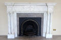 Painted timber fireplace in entrance hall at Rathfarnham Castle. Dublin, Ireland.