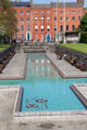 Cruciform pool of Garden of Remembrance with symbolic mosaic of discarded weapons on bottom of flowing river. Dublin, Ireland