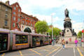 O'Connell Street tram mall with Daniel O'Connell Monument. Dublin, Ireland.